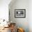 Domestic Piglet and Sunflowers, USA-Lynn M. Stone-Framed Photographic Print displayed on a wall