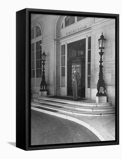 Doorman at the Entrance to Exelsior Hotel-Dmitri Kessel-Framed Premier Image Canvas