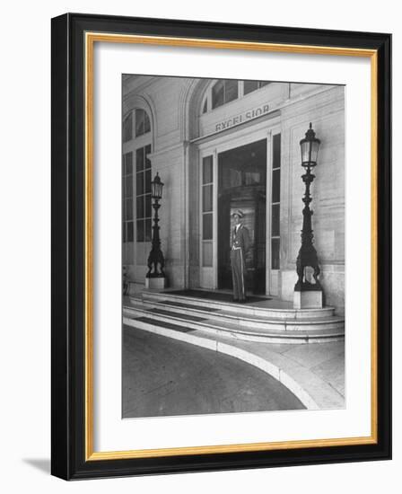 Doorman at the Entrance to Exelsior Hotel-Dmitri Kessel-Framed Photographic Print