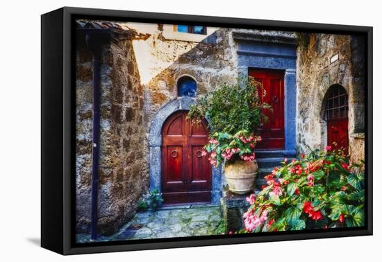 Doors And Flowers in Civita Di Bagnoregio-George Oze-Framed Premier Image Canvas