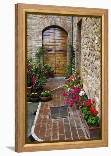 Doorway with Flowers, Pienza, Tuscany, Italy-Terry Eggers-Framed Premier Image Canvas