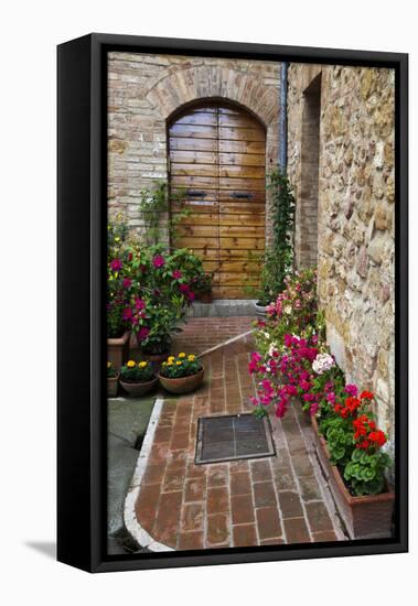 Doorway with Flowers, Pienza, Tuscany, Italy-Terry Eggers-Framed Premier Image Canvas