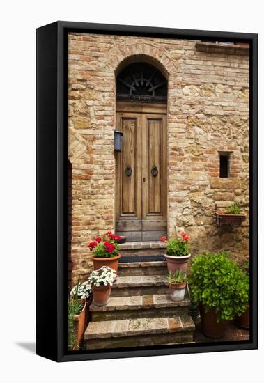 Doorway with Flowers, Pienza, Tuscany, Italy-Terry Eggers-Framed Premier Image Canvas