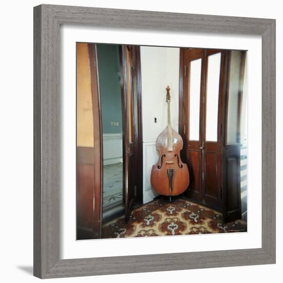 Double Bass Propped Against a Wall, Cienfuegos, Cuba, West Indies, Central America-Lee Frost-Framed Photographic Print