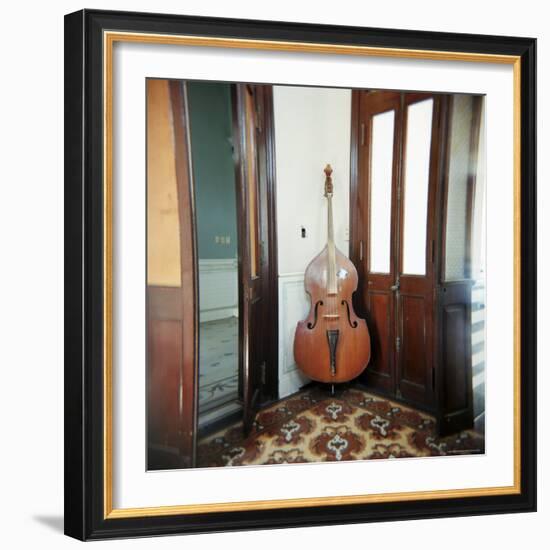 Double Bass Propped Against a Wall, Cienfuegos, Cuba, West Indies, Central America-Lee Frost-Framed Photographic Print