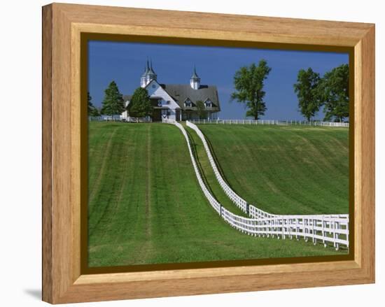 Double White Fence Flows from an Elegant Horse Barn, Woodford County, Kentucky, USA-Dennis Flaherty-Framed Premier Image Canvas