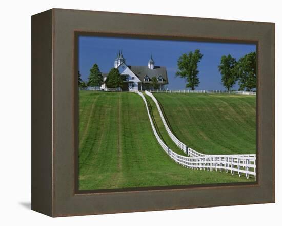 Double White Fence Flows from an Elegant Horse Barn, Woodford County, Kentucky, USA-Dennis Flaherty-Framed Premier Image Canvas