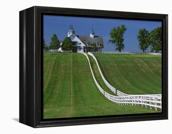 Double White Fence Flows from an Elegant Horse Barn, Woodford County, Kentucky, USA-Dennis Flaherty-Framed Premier Image Canvas
