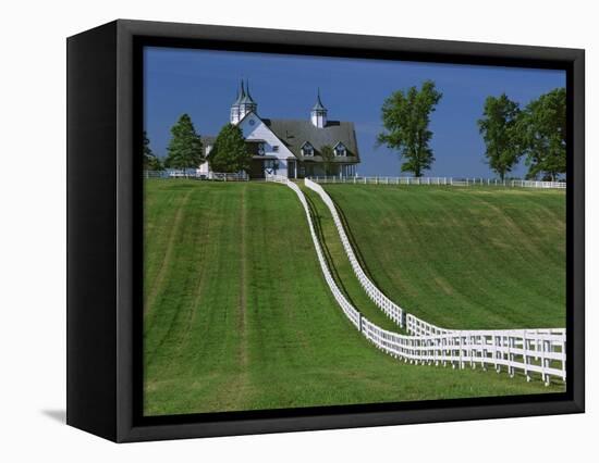 Double White Fence Flows from an Elegant Horse Barn, Woodford County, Kentucky, USA-Dennis Flaherty-Framed Premier Image Canvas