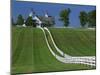 Double White Fence Flows from an Elegant Horse Barn, Woodford County, Kentucky, USA-Dennis Flaherty-Mounted Photographic Print