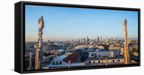 Downtown Milan as seen through the roof of the city's famous Duomo cathedral, Milan, Lombardy, Ital-Alexandre Rotenberg-Framed Premier Image Canvas