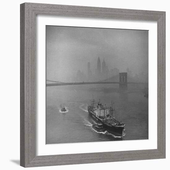 Downtown NY Seen through Mist Hovering over River, Yamashita Line Ship Coasting and Bridge-Eliot Elisofon-Framed Photographic Print