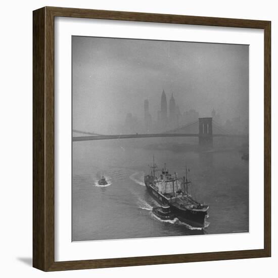 Downtown NY Seen through Mist Hovering over River, Yamashita Line Ship Coasting and Bridge-Eliot Elisofon-Framed Photographic Print