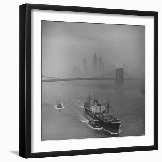 Downtown NY Seen through Mist Hovering over River, Yamashita Line Ship Coasting and Bridge-Eliot Elisofon-Framed Photographic Print