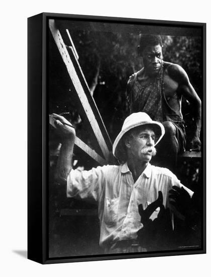 Dr. Albert Schweitzer, Medical Missionary and Humanitarian, with Carpenter at Site of His Hospital-W^ Eugene Smith-Framed Premier Image Canvas