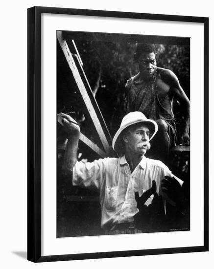 Dr. Albert Schweitzer, Medical Missionary and Humanitarian, with Carpenter at Site of His Hospital-W^ Eugene Smith-Framed Premium Photographic Print