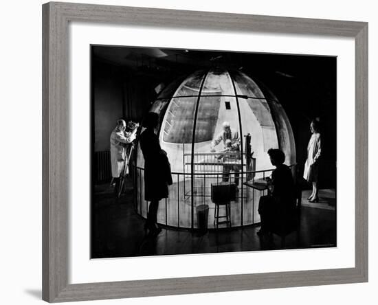 Dr. Arnold Gesell Studying Baby at Yale's Child Psychology Lab-Herbert Gehr-Framed Premium Photographic Print