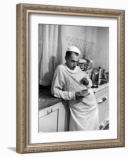 Dr. Ernest Ceriani in a State of Exhaustion, Having a Cup of Coffee in the Hospital Kitchen at 2 AM-W^ Eugene Smith-Framed Photographic Print
