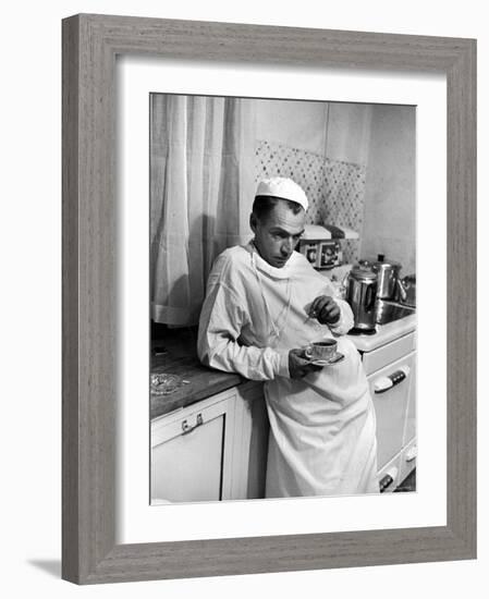 Dr. Ernest Ceriani in a State of Exhaustion, Having a Cup of Coffee in the Hospital Kitchen at 2 AM-W^ Eugene Smith-Framed Photographic Print