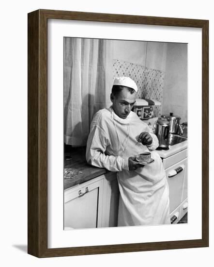 Dr. Ernest Ceriani in a State of Exhaustion, Having a Cup of Coffee in the Hospital Kitchen at 2 AM-W^ Eugene Smith-Framed Photographic Print