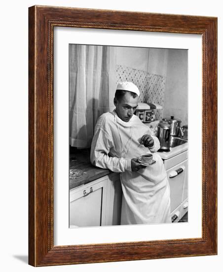 Dr. Ernest Ceriani in a State of Exhaustion, Having a Cup of Coffee in the Hospital Kitchen at 2 AM-W^ Eugene Smith-Framed Photographic Print