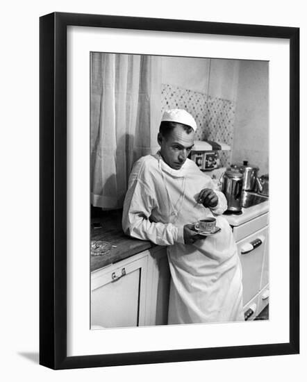 Dr. Ernest Ceriani in a State of Exhaustion, Having a Cup of Coffee in the Hospital Kitchen at 2 AM-W^ Eugene Smith-Framed Photographic Print