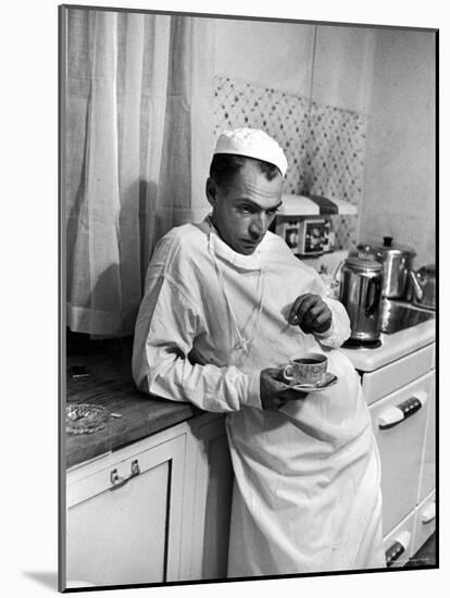 Dr. Ernest Ceriani in a State of Exhaustion, Having a Cup of Coffee in the Hospital Kitchen at 2 AM-W^ Eugene Smith-Mounted Photographic Print