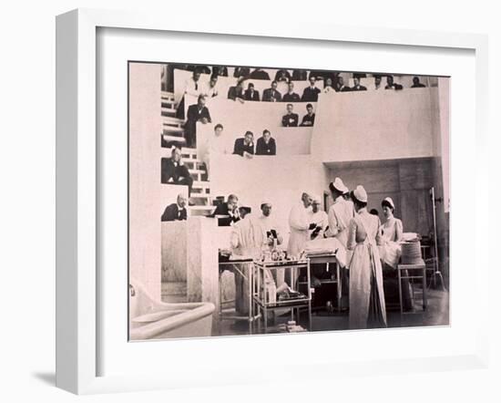 Dr. Harvey Cushing in the Operating Theater with an Audience of Physicians, 1910-null-Framed Photo