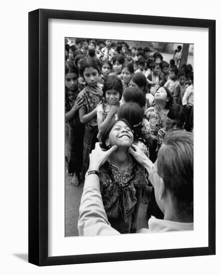 Dr. Nevin S. Scrimshaw of the Central American Institute of Nutrition Examining Children for Goiter-Cornell Capa-Framed Photographic Print