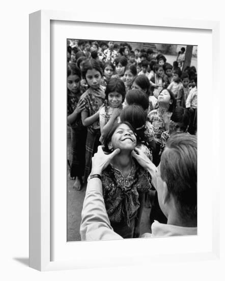 Dr. Nevin S. Scrimshaw of the Central American Institute of Nutrition Examining Children for Goiter-Cornell Capa-Framed Photographic Print