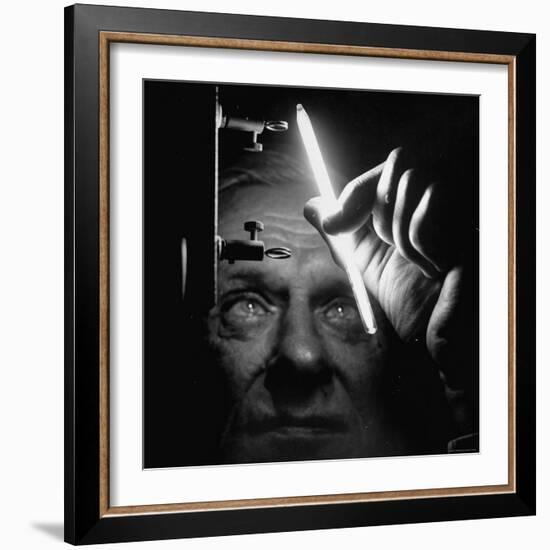 Dr. William Meggers, Making the Mercury Tube Glow by Holding It Near Two High Frequency Antennae-Andreas Feininger-Framed Photographic Print