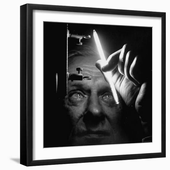 Dr. William Meggers, Making the Mercury Tube Glow by Holding It Near Two High Frequency Antennae-Andreas Feininger-Framed Photographic Print