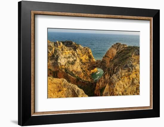 Dramatic Cliffs along the coast at Ponta da Piedade in Lagos, Portugal-Chuck Haney-Framed Photographic Print