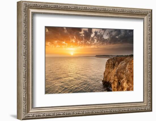 Dramatic sunset clouds over Cliffs along the coast at Ponta da Piedade in Lagos, Portugal-Chuck Haney-Framed Photographic Print