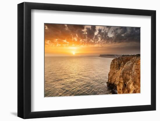 Dramatic sunset clouds over Cliffs along the coast at Ponta da Piedade in Lagos, Portugal-Chuck Haney-Framed Photographic Print