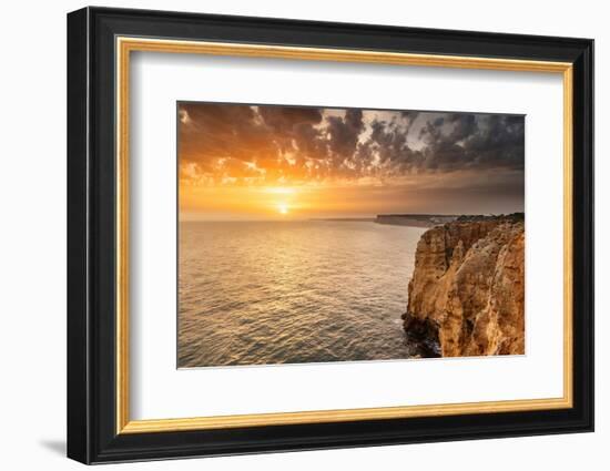 Dramatic sunset clouds over Cliffs along the coast at Ponta da Piedade in Lagos, Portugal-Chuck Haney-Framed Photographic Print