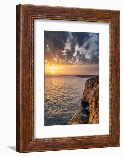 Dramatic sunset clouds over Cliffs along the coast at Ponta da Piedade in Lagos, Portugal-Chuck Haney-Framed Photographic Print