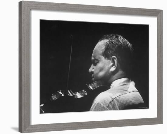 Dramatically Lit Shot of Violinist David Oistrakh Rehearsing Before Concert in Prades-Gjon Mili-Framed Premium Photographic Print