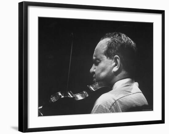 Dramatically Lit Shot of Violinist David Oistrakh Rehearsing Before Concert in Prades-Gjon Mili-Framed Premium Photographic Print