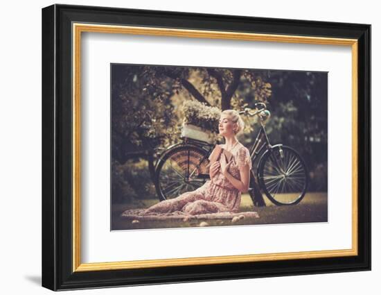 Dreaming Blond Retro Woman with a Book Sitting on a Meadow-NejroN Photo-Framed Photographic Print