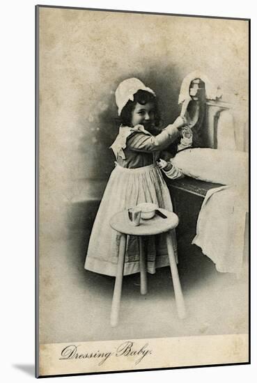 Dressing Baby -- Little Girl with Her Doll-null-Mounted Art Print