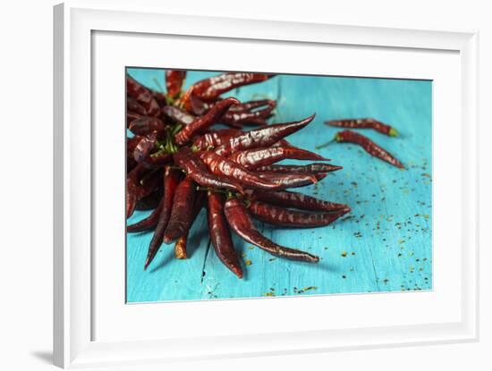 Dried Chillipods on Turquoise Wood-Jana Ihle-Framed Photographic Print