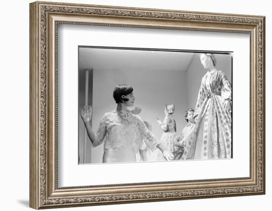 Drinking Guest Looking at a Display at the Met Fashion Ball, New York, New York, November 1960-Walter Sanders-Framed Photographic Print