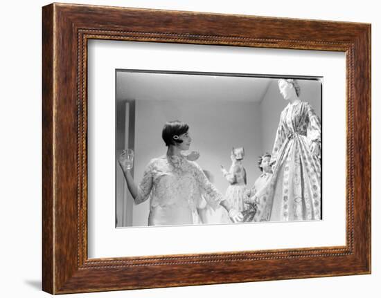 Drinking Guest Looking at a Display at the Met Fashion Ball, New York, New York, November 1960-Walter Sanders-Framed Photographic Print