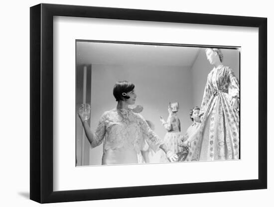 Drinking Guest Looking at a Display at the Met Fashion Ball, New York, New York, November 1960-Walter Sanders-Framed Photographic Print