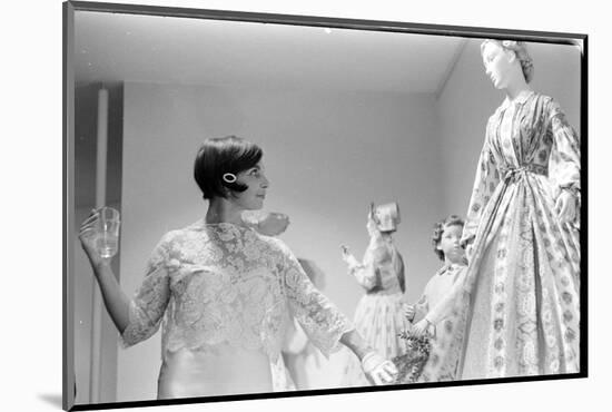 Drinking Guest Looking at a Display at the Met Fashion Ball, New York, New York, November 1960-Walter Sanders-Mounted Photographic Print