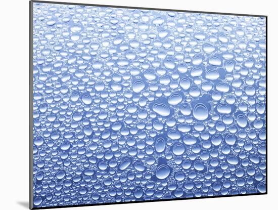 Drops of Water on Sheet of Glass with Blue Background-Marc O^ Finley-Mounted Photographic Print