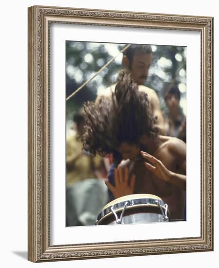 Drummer Playing Instrument with Hands During Woodstock Music Festival-Bill Eppridge-Framed Photographic Print