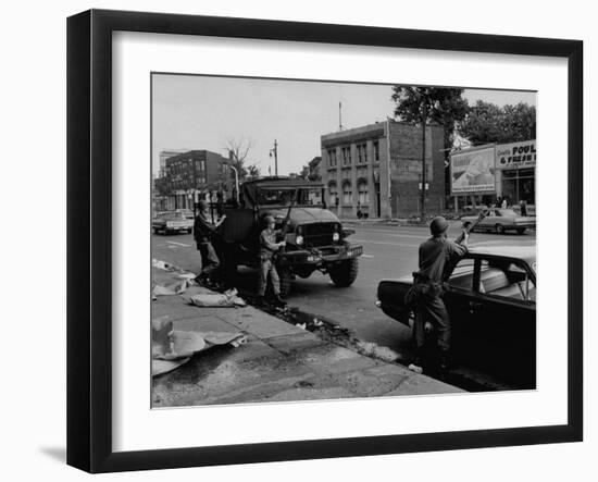 During Race Riots in Detroit, National Guard Patroling Devastated Neighborhood-null-Framed Photographic Print