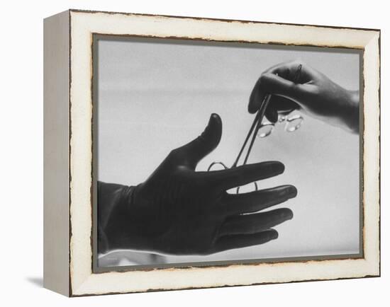 During Training of Surgeon, Often Used Clamp Is Slapped into His Hand-Ed Clark-Framed Premier Image Canvas